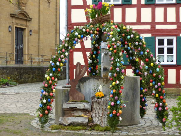 part of franconian osterbrunnen in Germany, Bavaria. Traditional use at Easter in Franconia to decorate village fountains with colorful Easter eggs and flowers