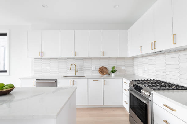 istock A white kitchen detail with a picket tile backsplash and gold faucet and hardware. 2164806957