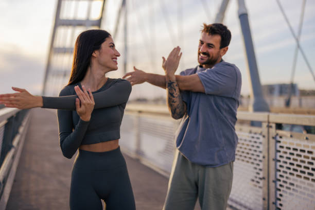 istock Stretching arms outdoors for health and wellness 2164807256