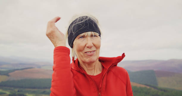 istock Putting on a midge net in Scotland. 2164811836