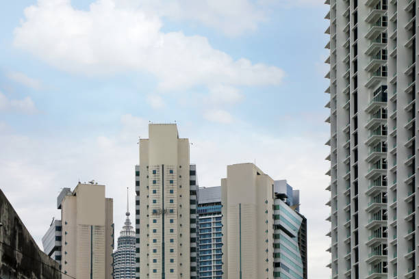 Modern buildings in Kuala Lumpur over sky