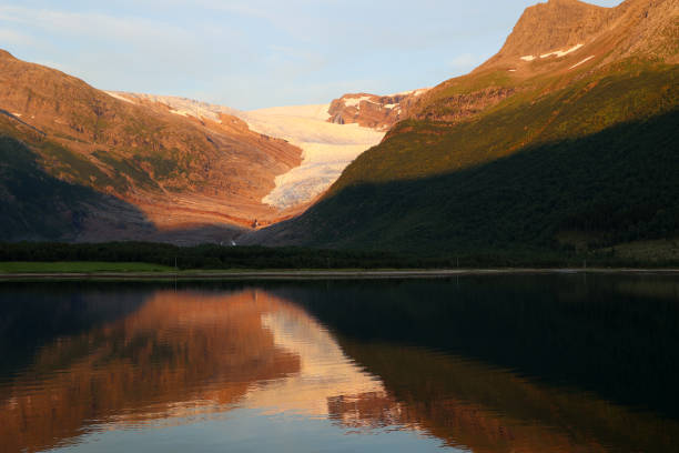 istock Mountain landscape reflected in the Holandsfjord at sunset, Norway 2164815254