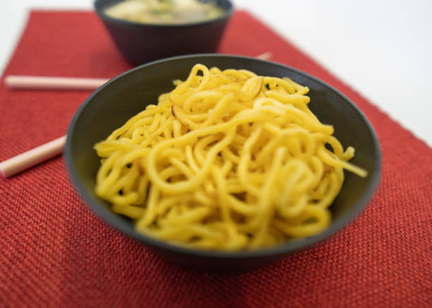 Yakissoba in lunchbox and bowl with chopsticks Chic Asian food