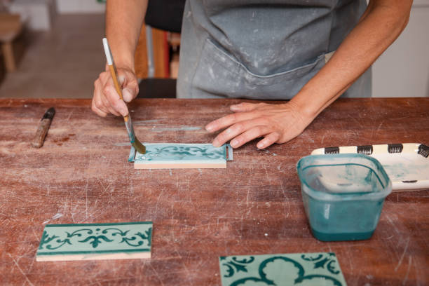 istock Female artist painting tile 2164817416