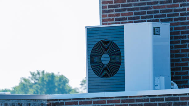 istock Air Source Heat Pump Installed on Rooftop Under Clear Blue Sky 2164817501