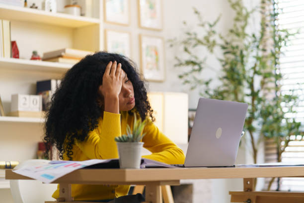 istock A woman has stress and a headache. Mental health problems from overwork Social problems, depression concept. 2164817612