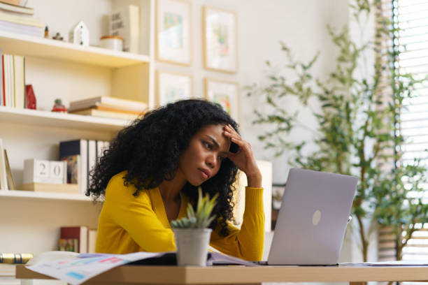 istock A woman has stress and a headache. Mental health problems from overwork Social problems, depression concept. 2164817614