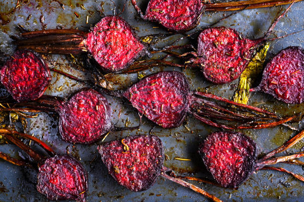 Top view of baked beet after baking in the baking oven. Roasted beetroot with spices close up. Baked beets with olive oil, salt and pepper