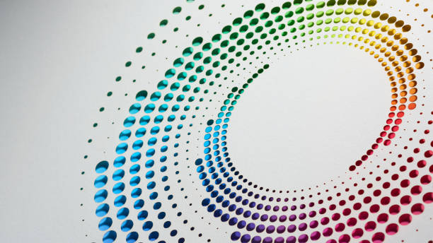 istock Vibrant circular paper artwork with a rainbow gradient, showcasing intricate cut-out patterns on white 2164819661