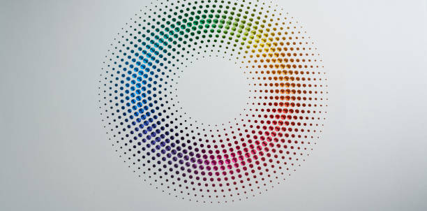 istock Intricately designed paper art featuring a gradient rainbow pattern in a circular arrangement on a plain background 2164819679