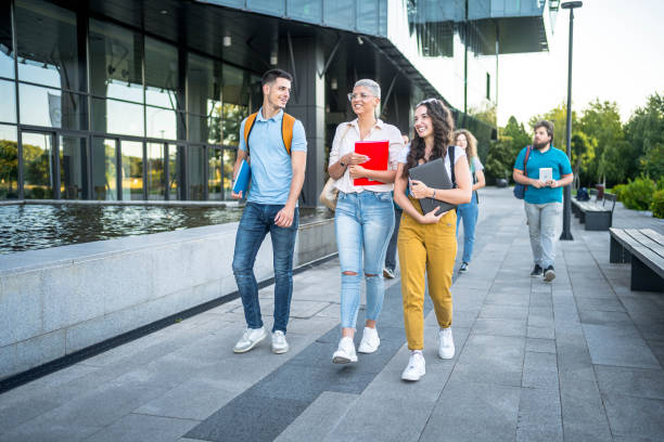 istock Friends walking on university campus 2164820277