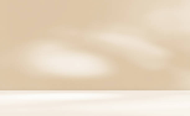 istock Empty cream beige room studio with shadow of leaves for product presentation. 2164821760