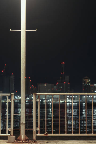 Fences along the seafront at night.