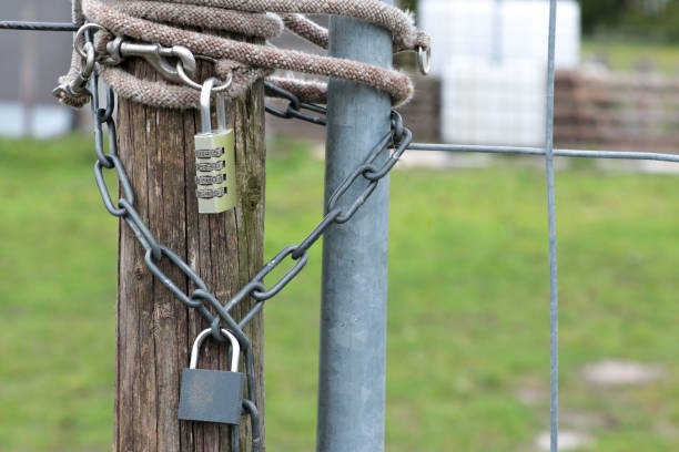 istock Padlock combination lock with chain on the fence 2164823076