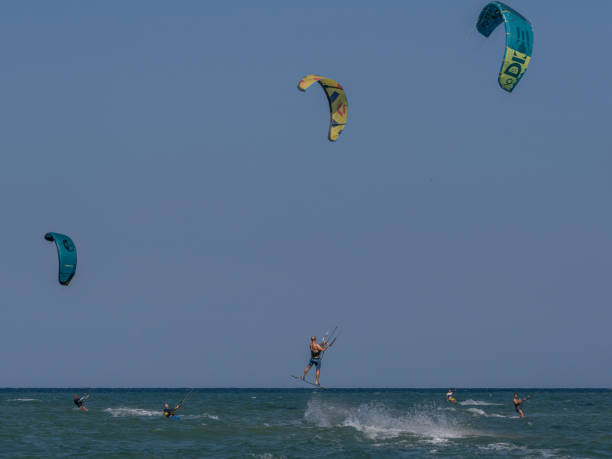 Marina Palmense, Fermo, Marche, Italy: July 29, 2024 - Kiteserf is practiced on the beach of Marina Palmense near Fermo.A group of people has created an association to share and improve their passion