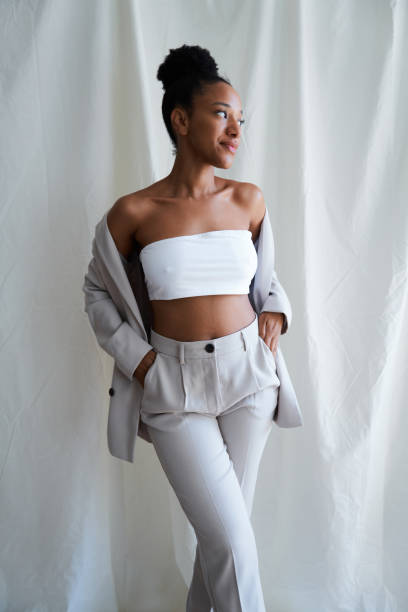 istock Confident young black woman posing in stylish clothes 2164824799