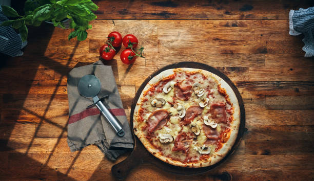 istock Pizza with Prosciutto Cotto Ham and Mushrooms 2164825529
