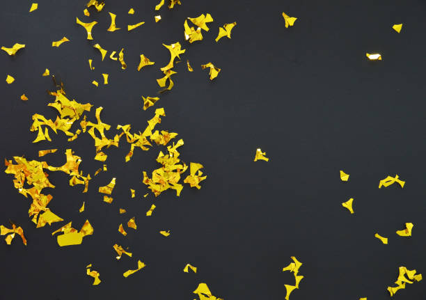 istock Sparkle golden confetti on a black background 2164825681