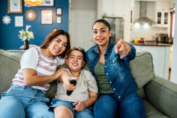 istock Family watching tv at home 2164825707