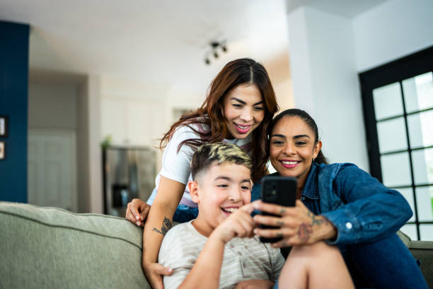 istock Mothers and son using mobile phone at home 2164826252