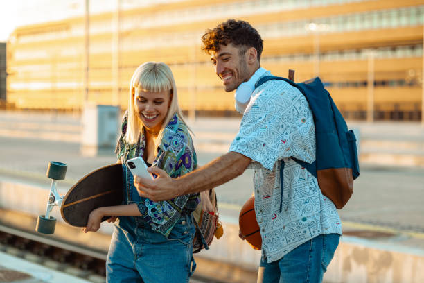 istock Urban young people on a railroad station 2164826552
