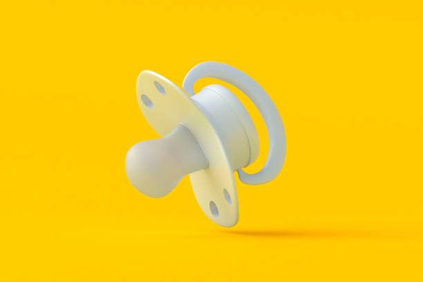 istock Falling baby pacifier on orange background. Newborn accessory. Motherhood equipment. 3d render 2164826839