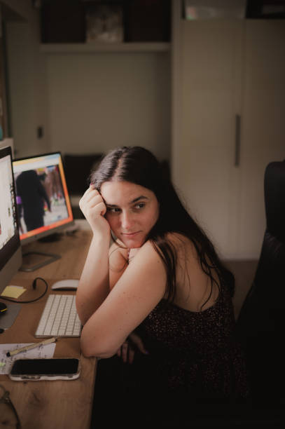 istock Young woman in a desk 2164826905