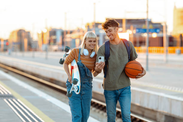 istock Urban young people on a railroad station 2164827674