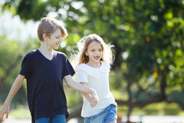 istock Caucasian white siblings playing at the park in morning. 2164828155