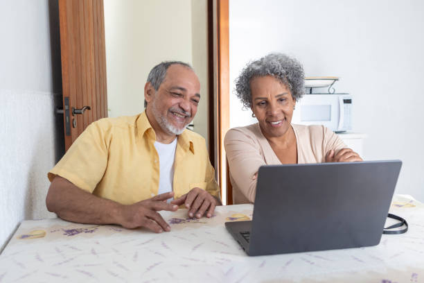 istock Middle-aged couple having virtual consultation with doctor 2164832914