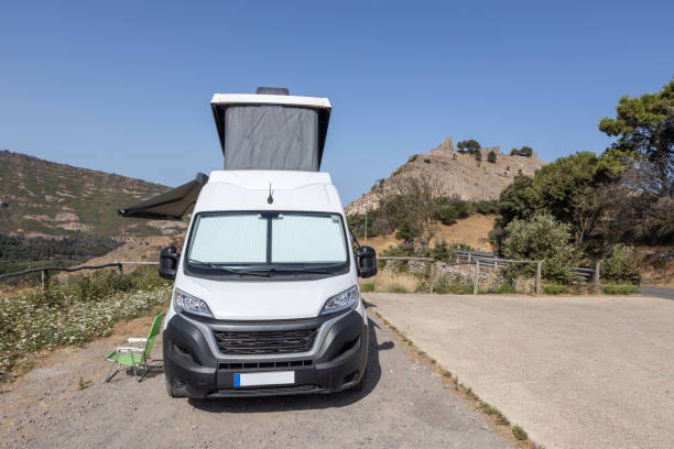 istock White Camper Van Parked in Scenic Mountain Area 2164833402