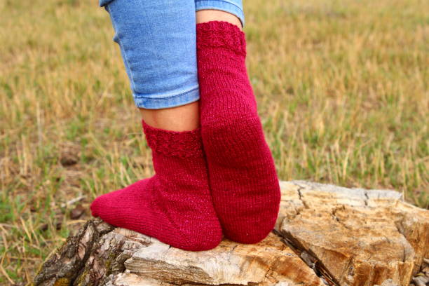 istock A person wearing red boots and red socks 2164837614