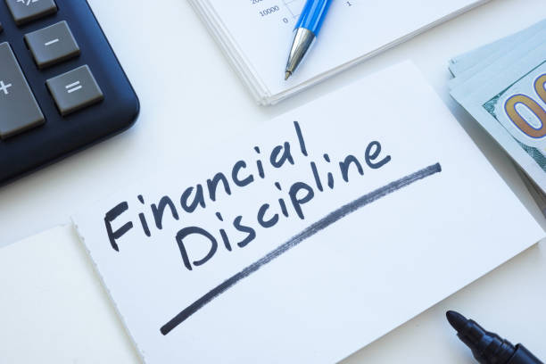 istock Open notepad with inscription financial discipline and money. 2164841278