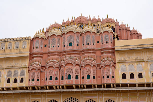 Jaipur, India - December 11, 2019: People at the beautiful Hawa Mahal, Palace of Winds in the pink city.