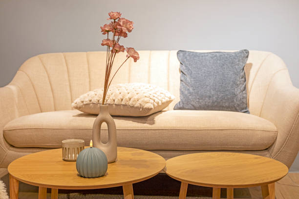istock vase with decorative flowers on a round table in the interior. Modern interior 2164844880