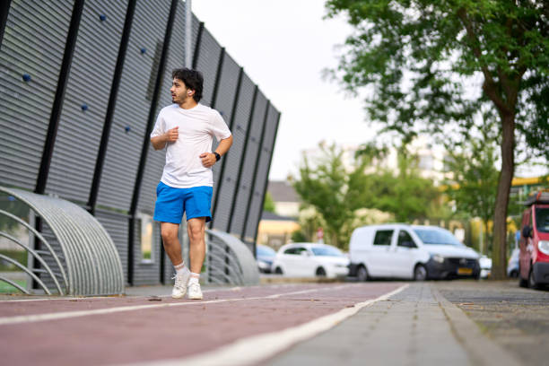 young overweight man is running.