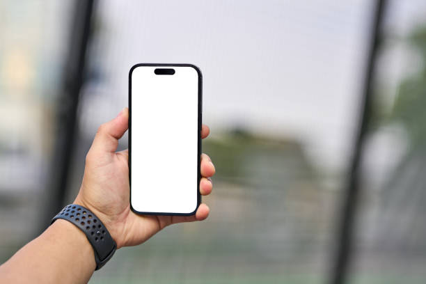 istock close up, young man with white screen phone in hand on jogging path. 2164846754