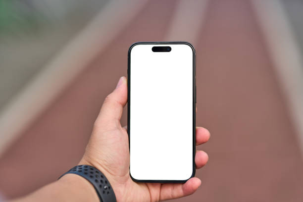 istock close up, young man with white screen phone in hand on jogging path. 2164846816