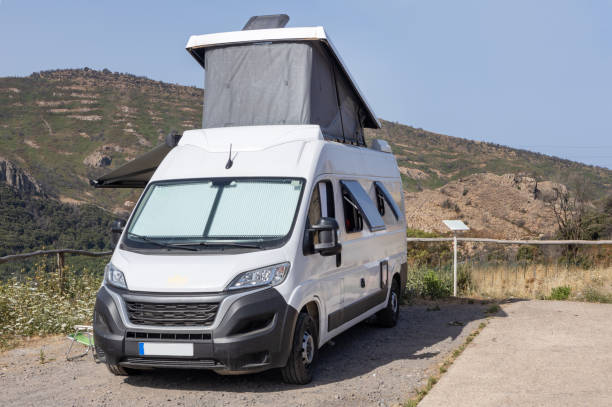 istock Camper Van Parked in Mountain Landscape 2164848471