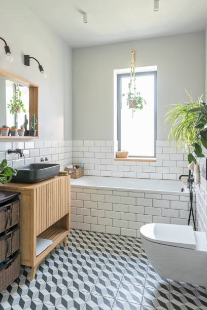 istock Modern interior of bathroom with window and pattern tiled floor. Industrial style and design decor. Vertical. 2164848720