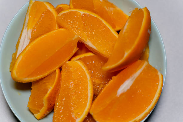 Orange sliced on a plate. Close-up.