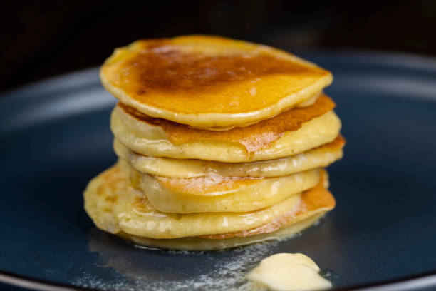 istock milk pancakes with butter on a blue plate 2164862490
