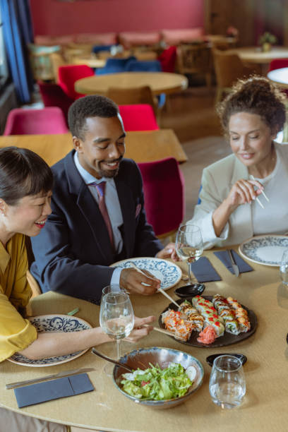 istock Businesspeople networking at lunch 2164863707