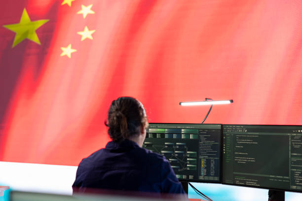 istock Chinese IT expert works at pc in governmental operations agency office 2164863965