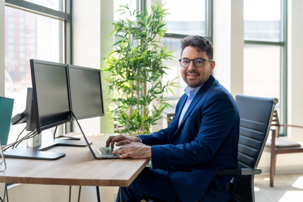 istock Mexican man working in a modern office 2164866225