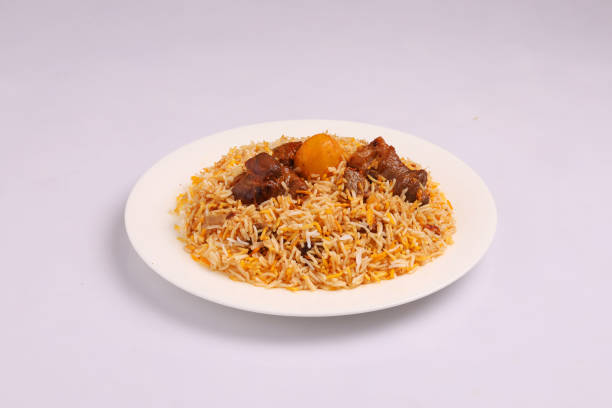 istock Kacchi Biryani in a white plate 2164867084