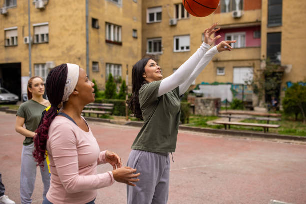 istock Basketball players training jump shot 2164870057
