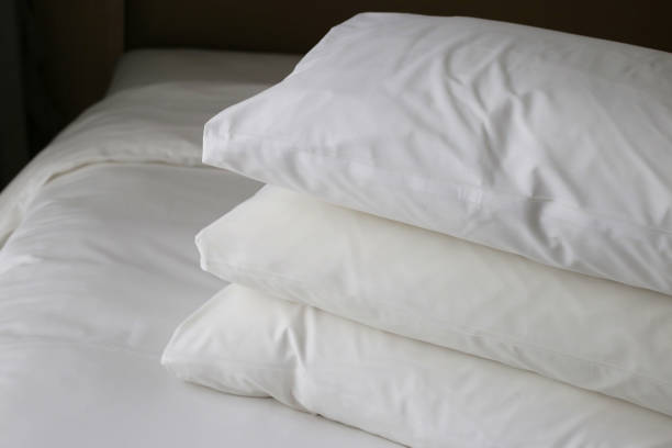istock Bed with pillows in bedroom hotel 2164870872