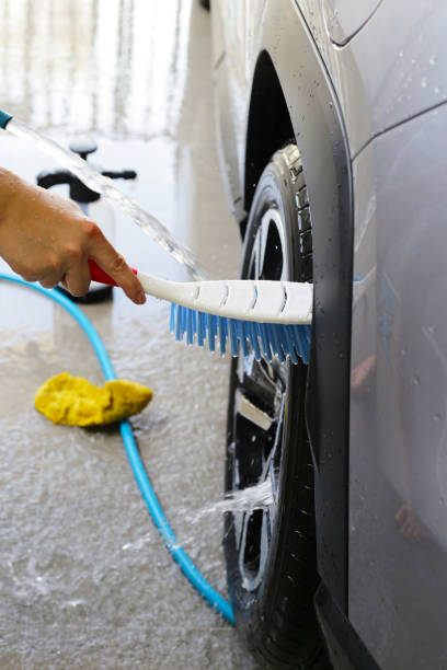 istock Washing car, cleaning tires and wheels 2164870875