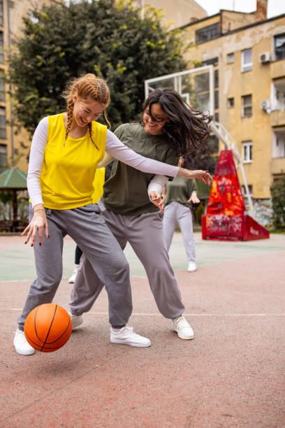 istock Young women in basketball duel 2164871509
